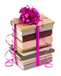 Photo of Stack of books with purple bow as gift isolated on white