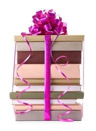 Photo of Stack of books with purple bow as gift isolated on white