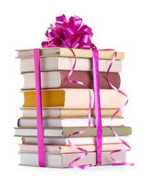 Photo of Stack of books with purple bow as gift isolated on white