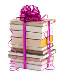 Photo of Stack of books with purple bow as gift isolated on white