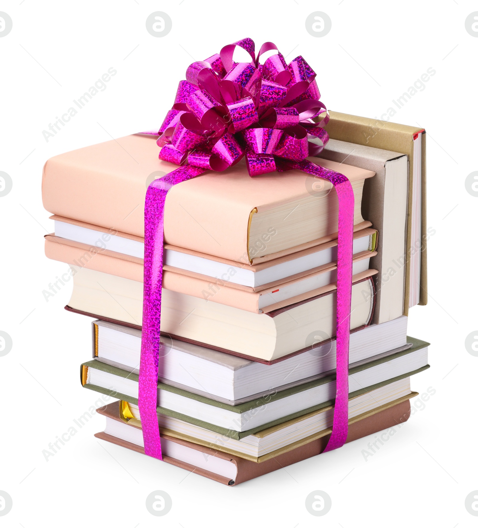 Photo of Stack of books with purple bow as gift isolated on white