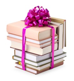 Photo of Stack of books with purple bow as gift isolated on white