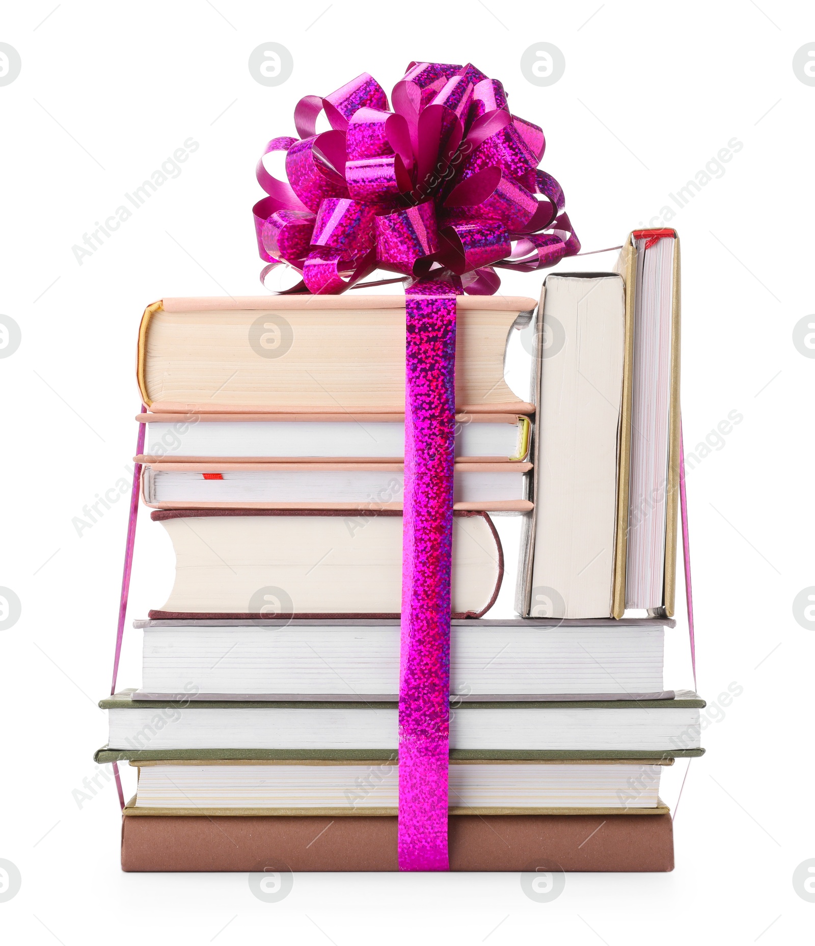 Photo of Stack of books with purple bow as gift isolated on white