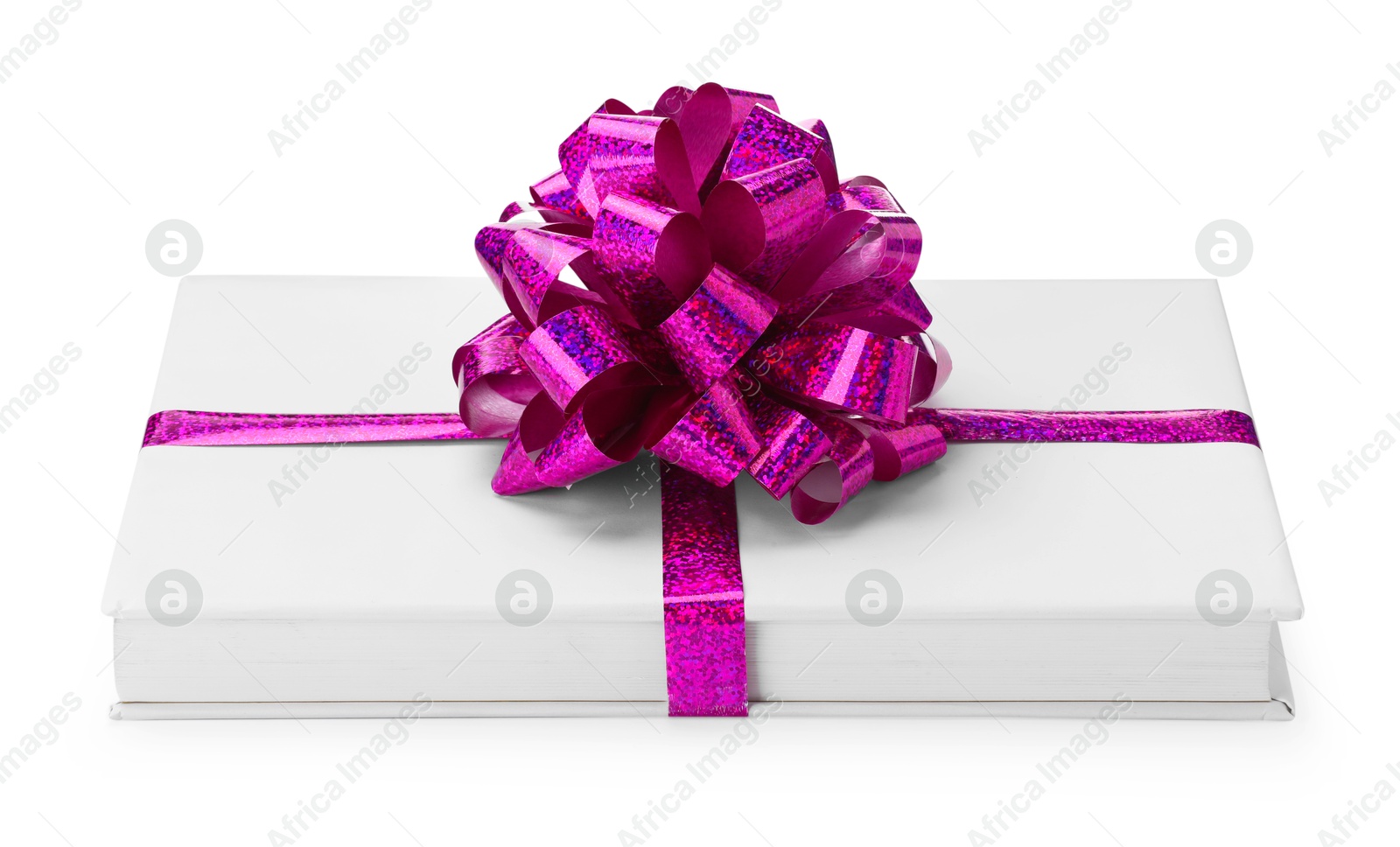 Photo of One book with purple bow as gift isolated on white