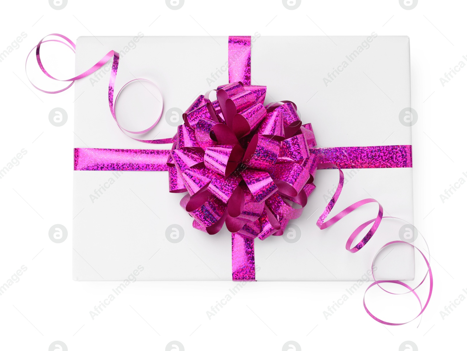 Photo of One book with purple bow as gift isolated on white, top view