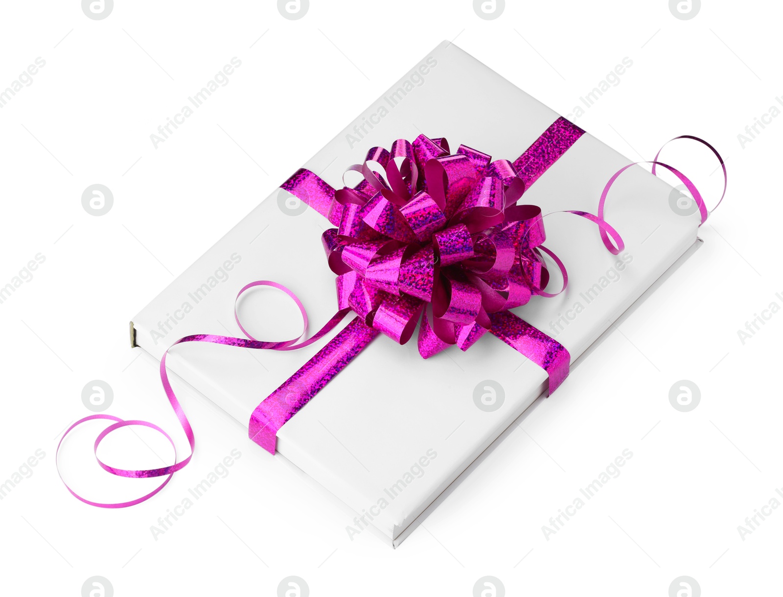 Photo of One book with purple bow as gift isolated on white