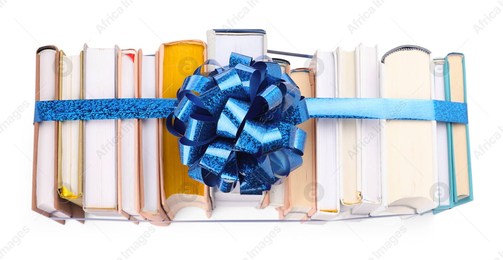 Photo of Books with blue bow as gift isolated on white, top view