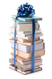 Photo of Stack of books with blue bow as gift isolated on white