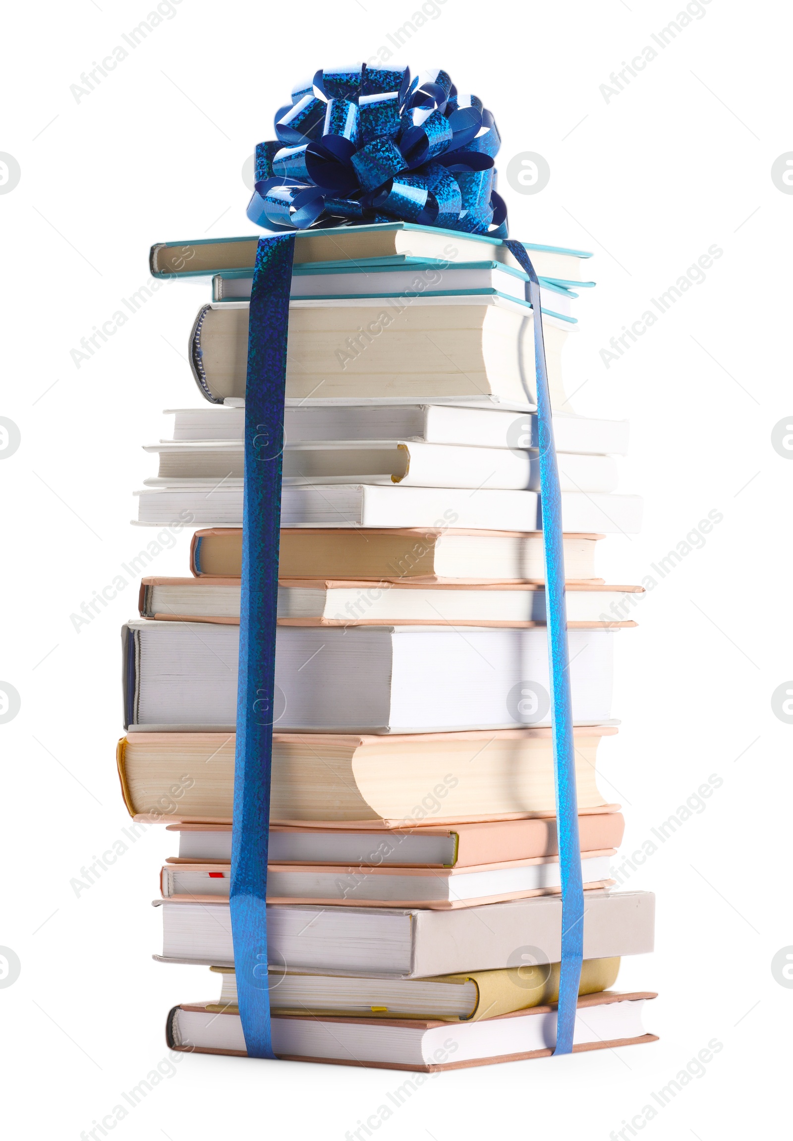 Photo of Stack of books with blue bow as gift isolated on white