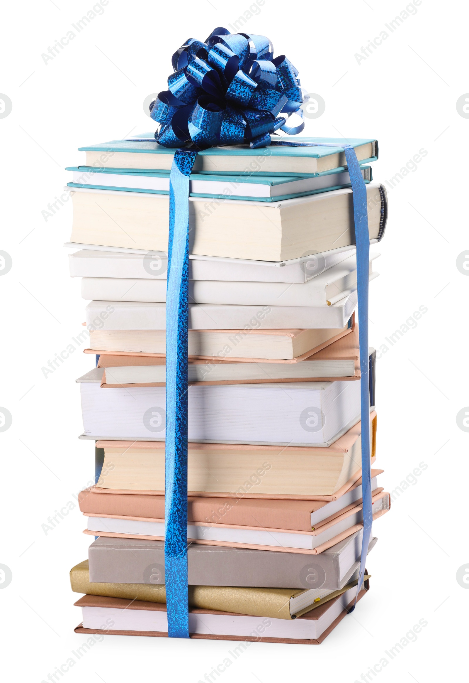 Photo of Stack of books with blue bow as gift isolated on white