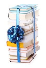 Photo of Stack of books with blue bow as gift isolated on white