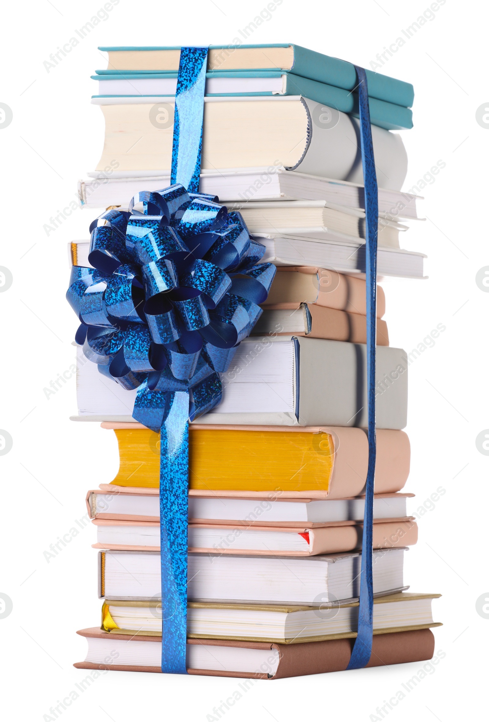 Photo of Stack of books with blue bow as gift isolated on white