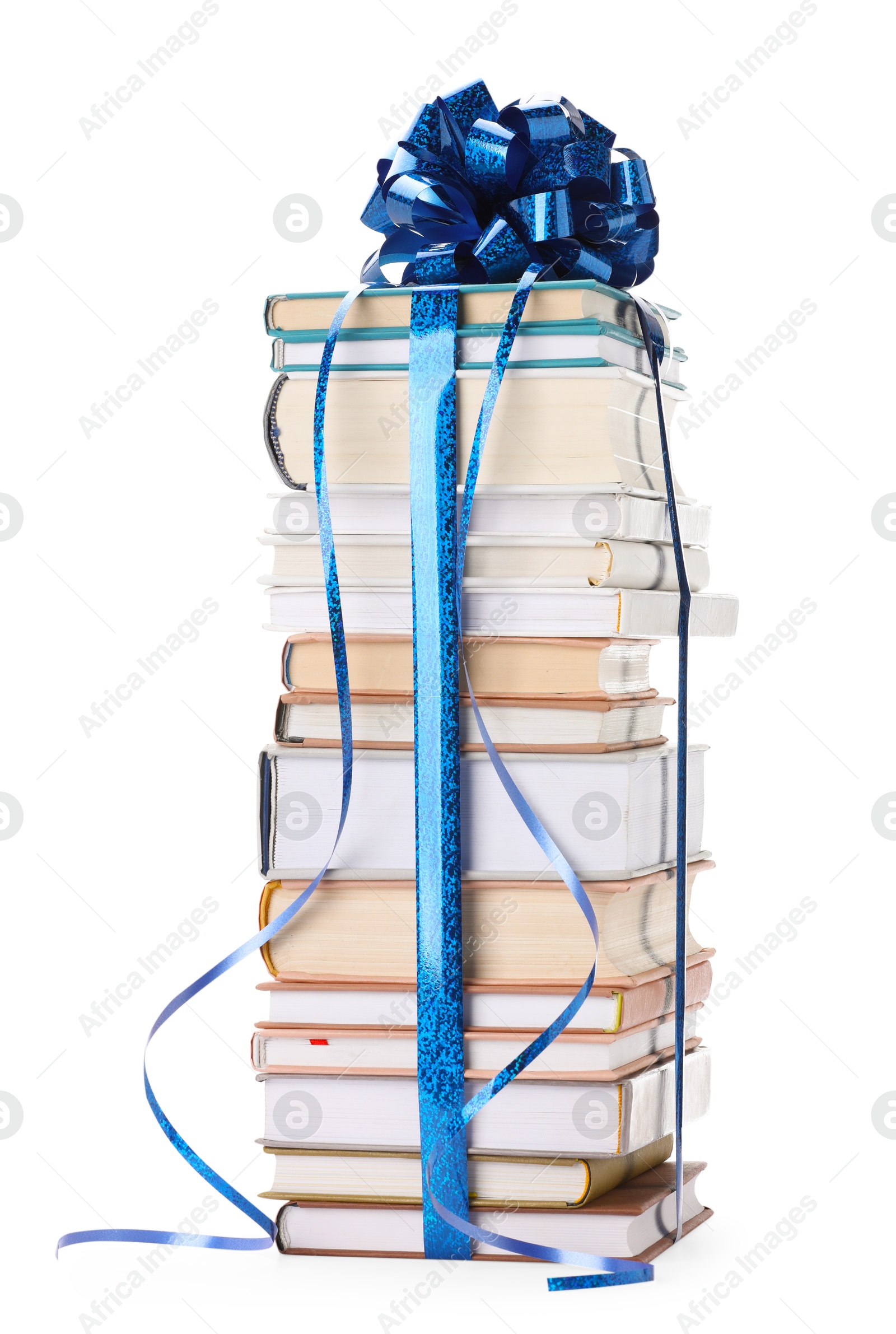 Photo of Stack of books with blue bow as gift isolated on white