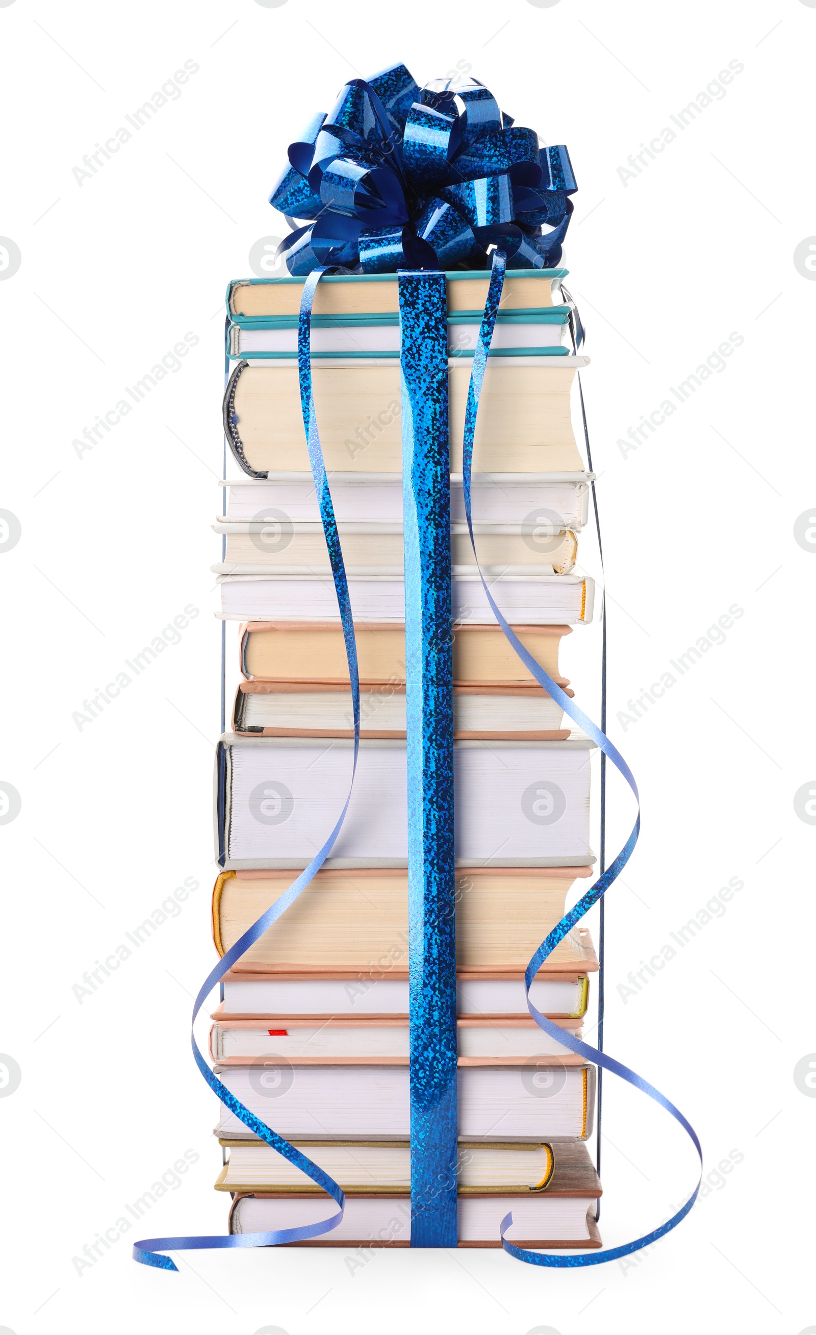 Photo of Stack of books with blue bow as gift isolated on white