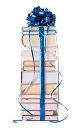 Photo of Stack of books with blue bow as gift isolated on white