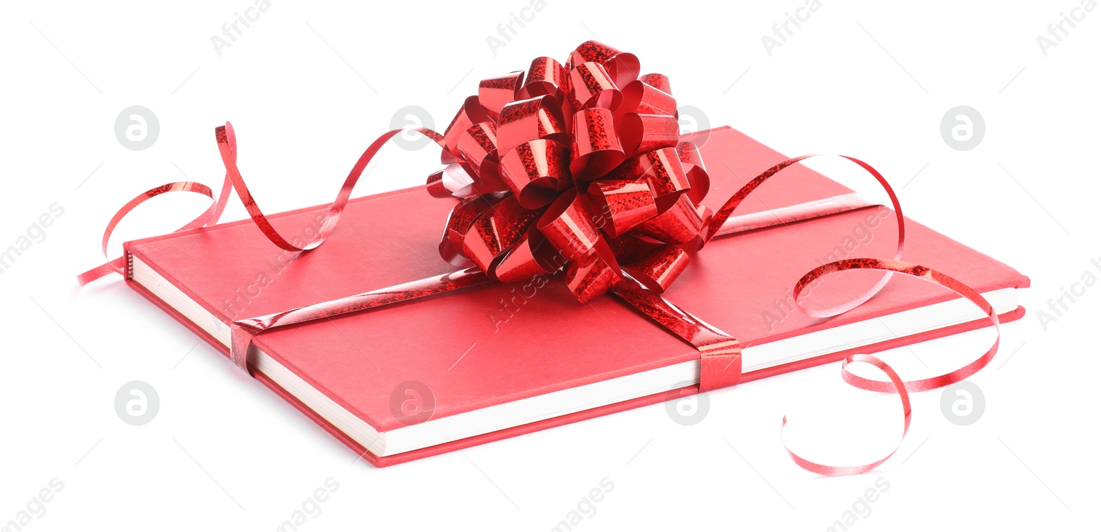 Photo of One book with red bow as gift isolated on white