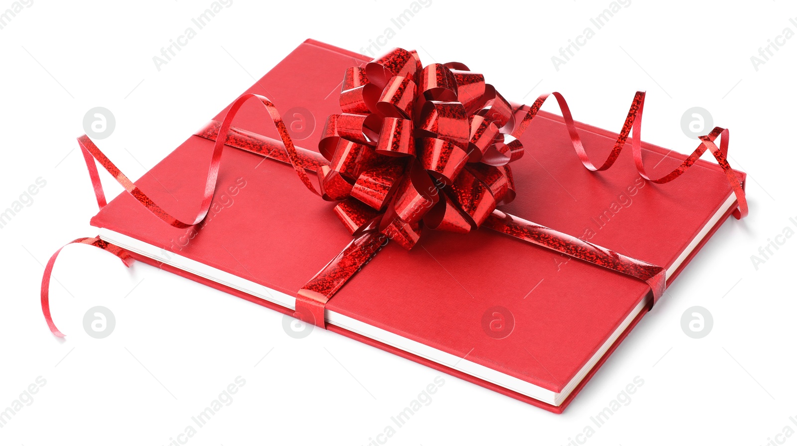 Photo of One book with red bow as gift isolated on white