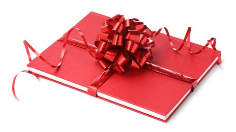 Photo of One book with red bow as gift isolated on white