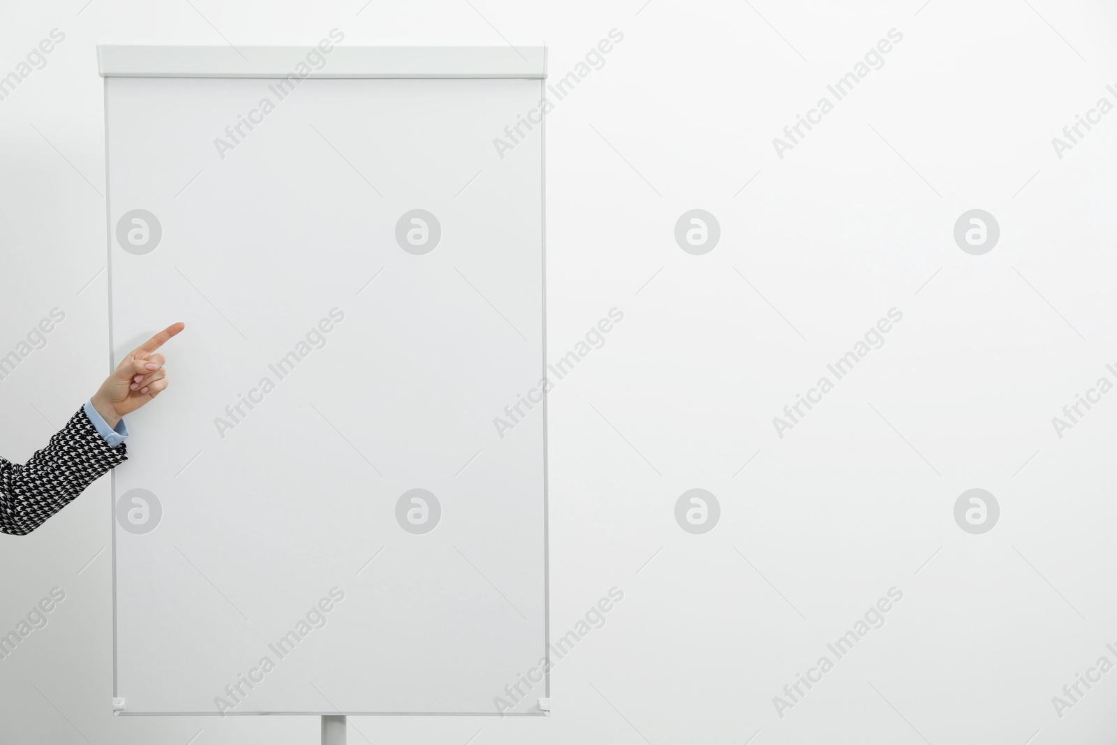 Photo of Woman near flip chart on white background, closeup. Mockup for design