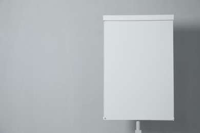 Photo of Flip chart on grey background. Mockup for design