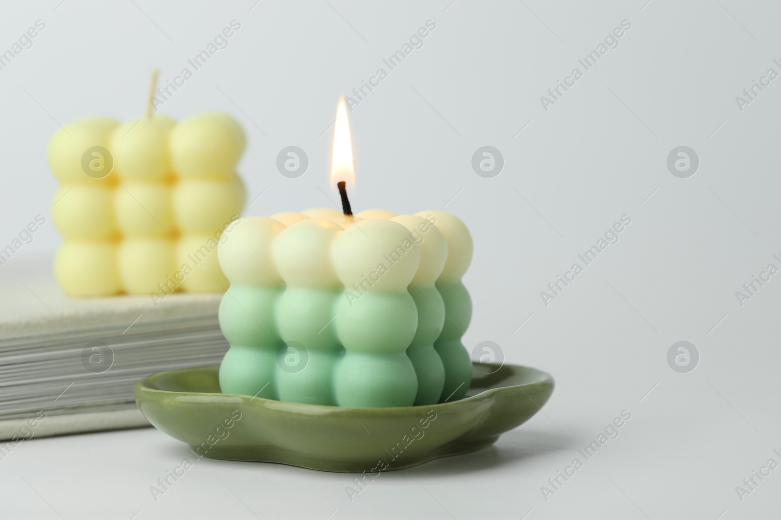 Photo of Beautiful bubble candles on light background, closeup