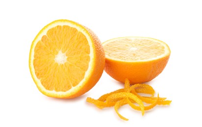 Photo of Halves of fresh orange and zest isolated on white