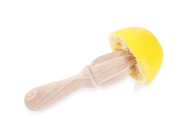 Photo of Wooden squeezer and lemon isolated on white, top view