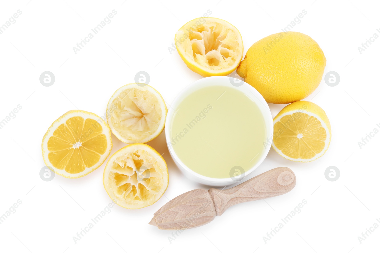 Photo of Fresh lemon juice in bowl, squeezer and fruits isolated on white, top view