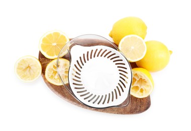 Photo of Juicer and fresh lemons isolated on white, top view