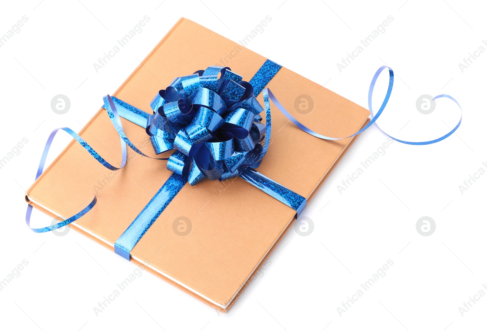 Photo of One book with blue bow as gift isolated on white