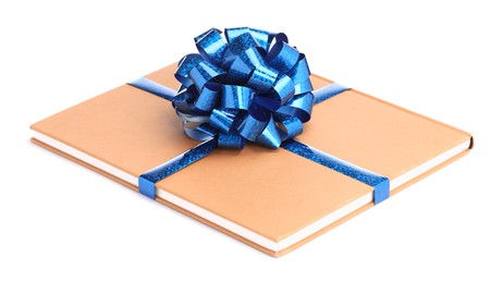 Photo of One book with blue bow as gift isolated on white