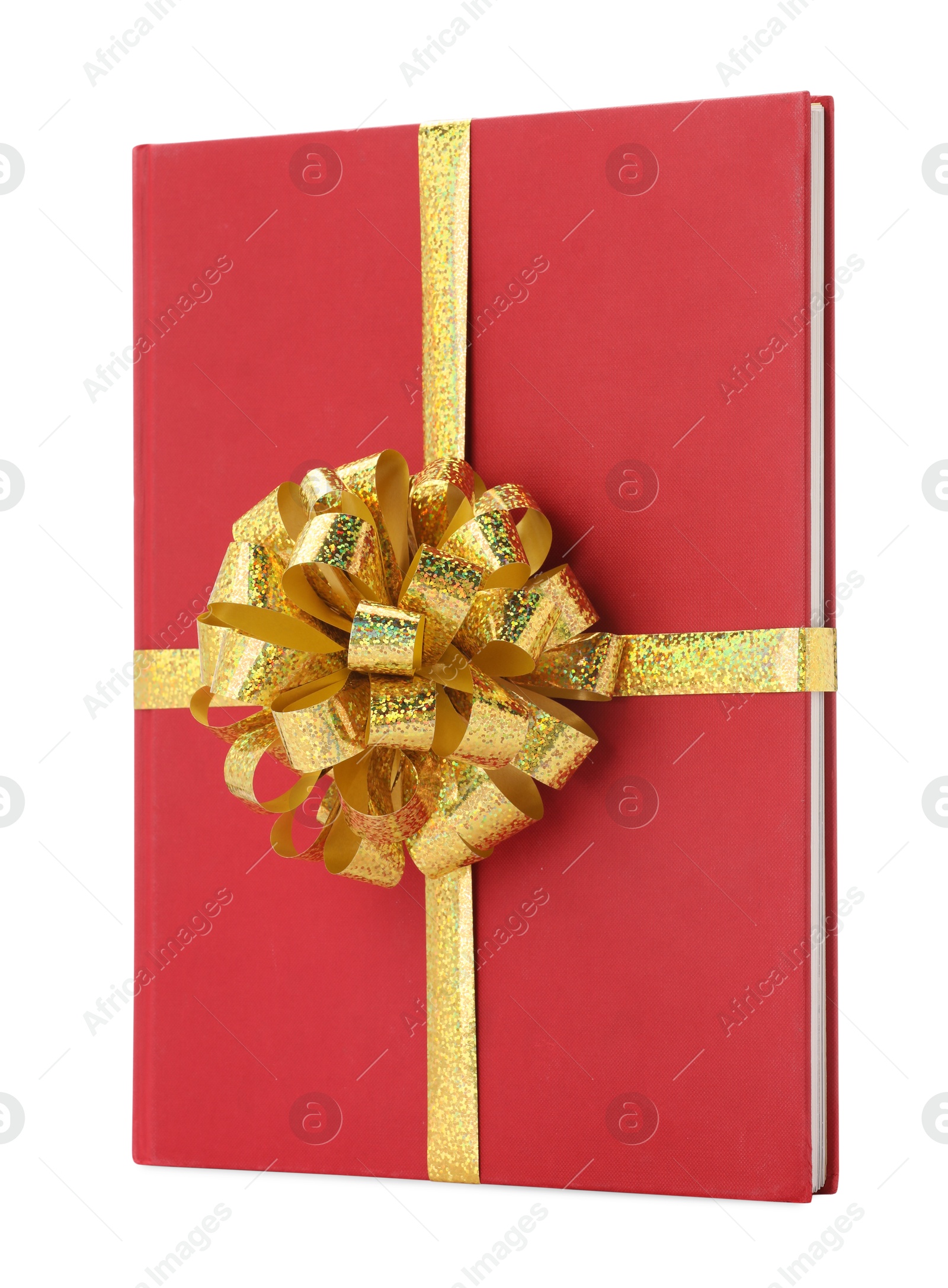 Photo of One book with golden bow as gift isolated on white