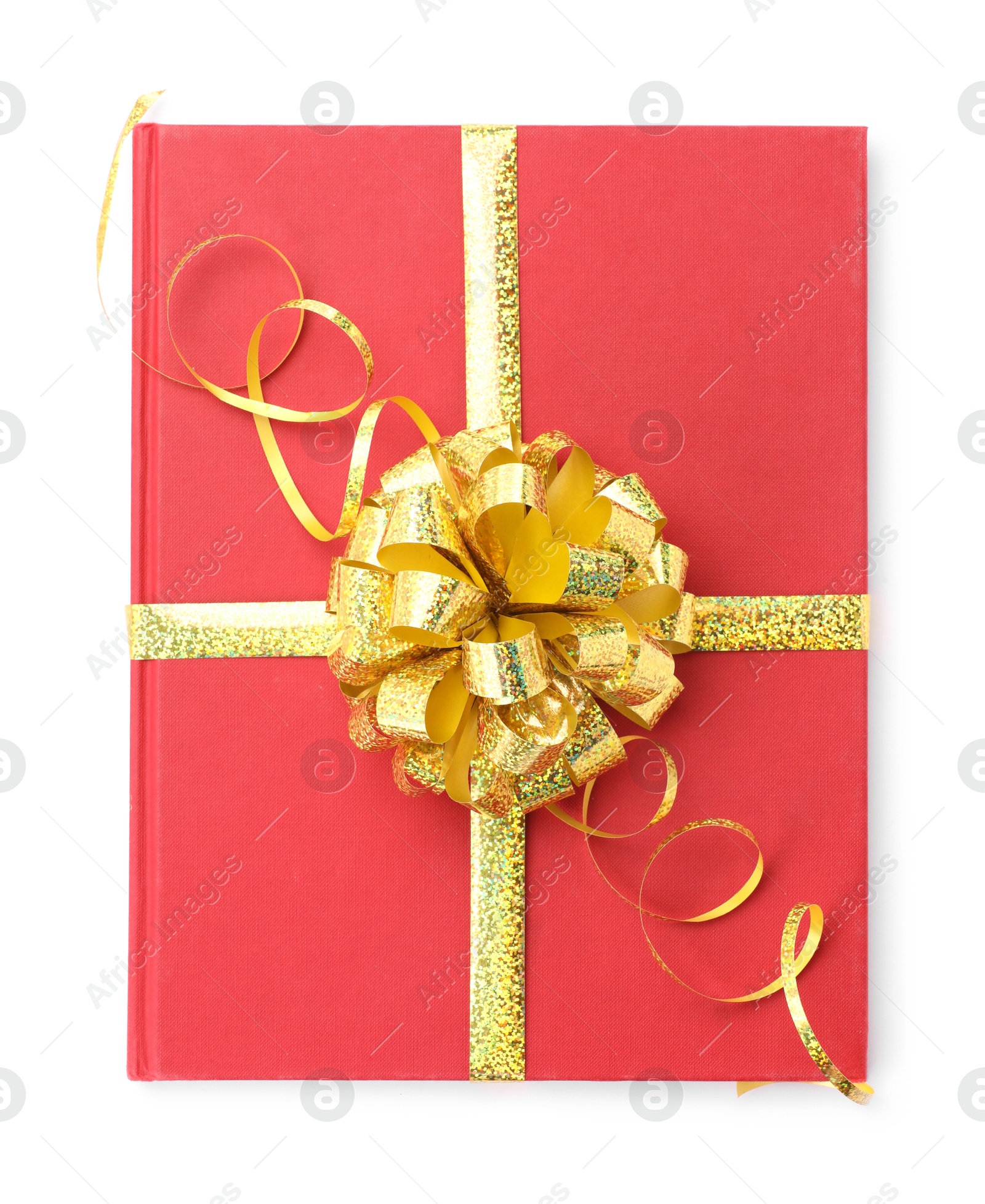 Photo of One book with golden bow as gift isolated on white, top view