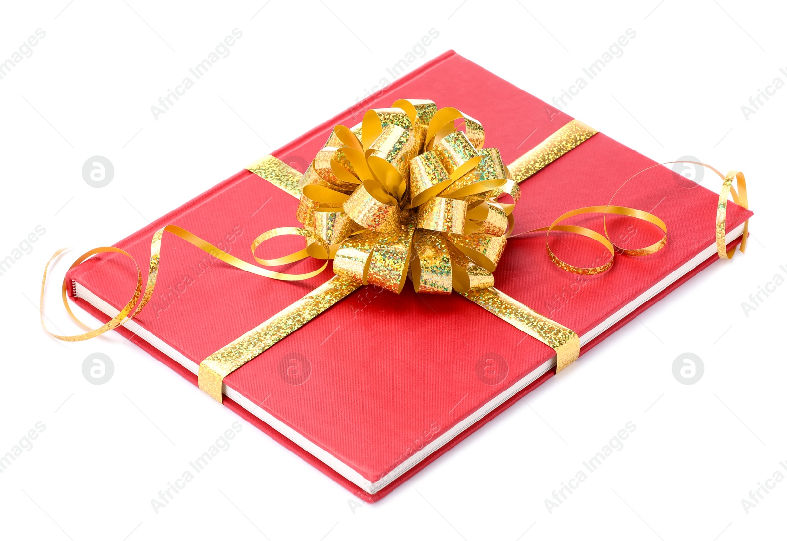 Photo of One book with golden bow as gift isolated on white