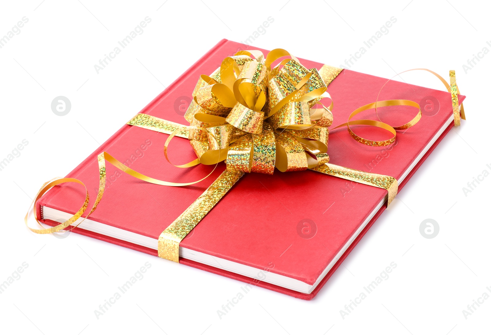 Photo of One book with golden bow as gift isolated on white