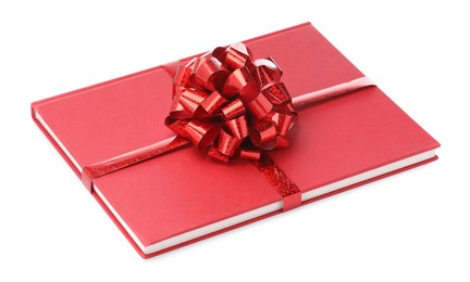 Photo of One book with red bow as gift isolated on white