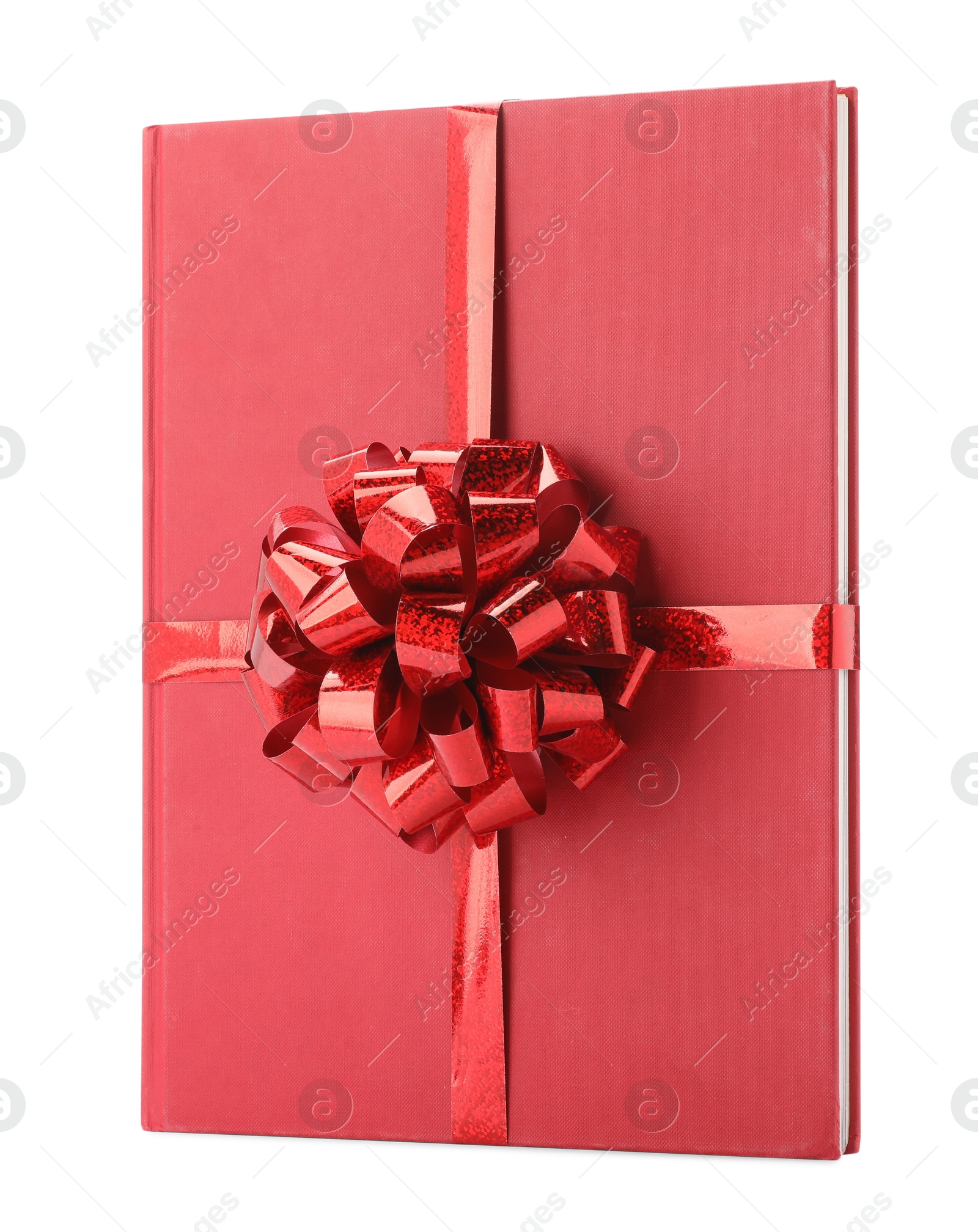 Photo of One book with red bow as gift isolated on white