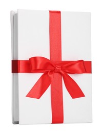 Photo of One book with red ribbon as gift isolated on white