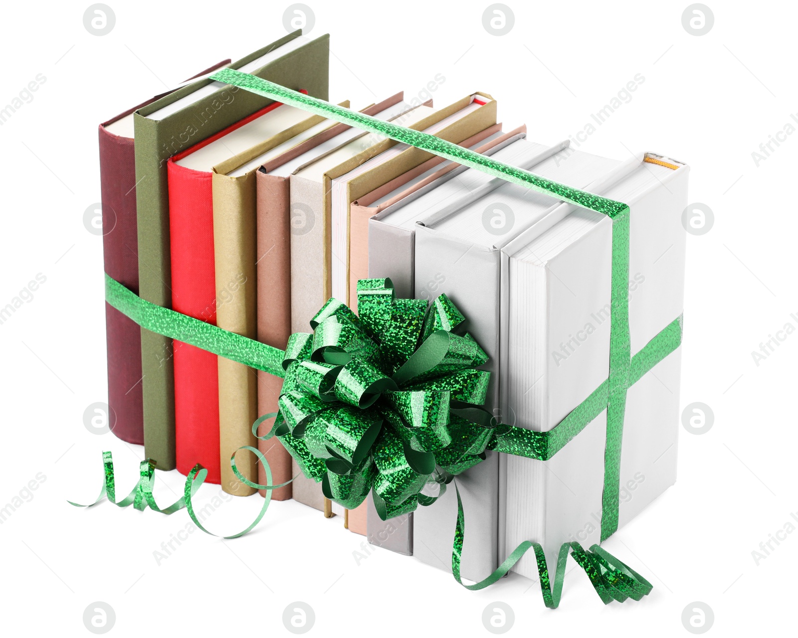 Photo of Many books with green bow as gift isolated on white