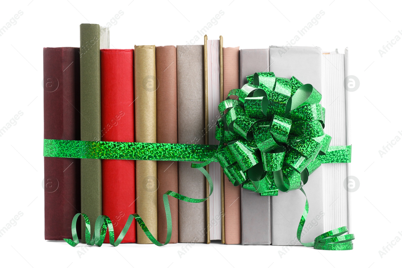 Photo of Many books with green bow as gift isolated on white