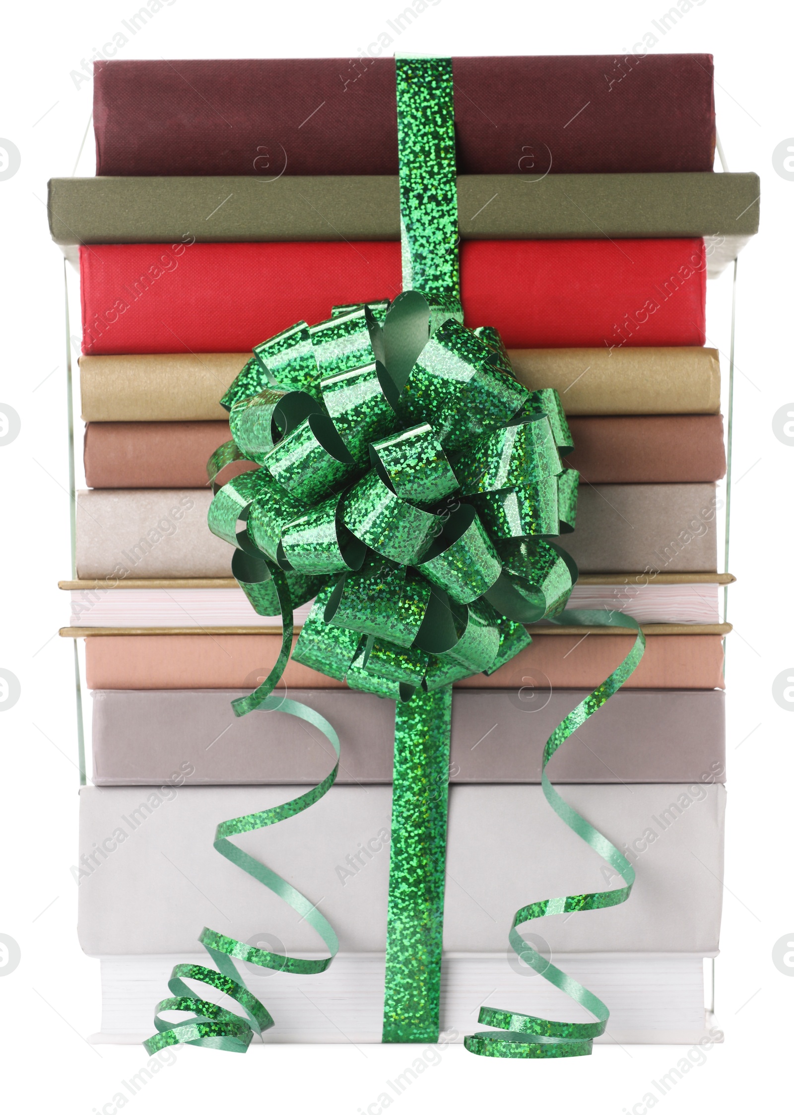 Photo of Stack of books with green bow as gift isolated on white