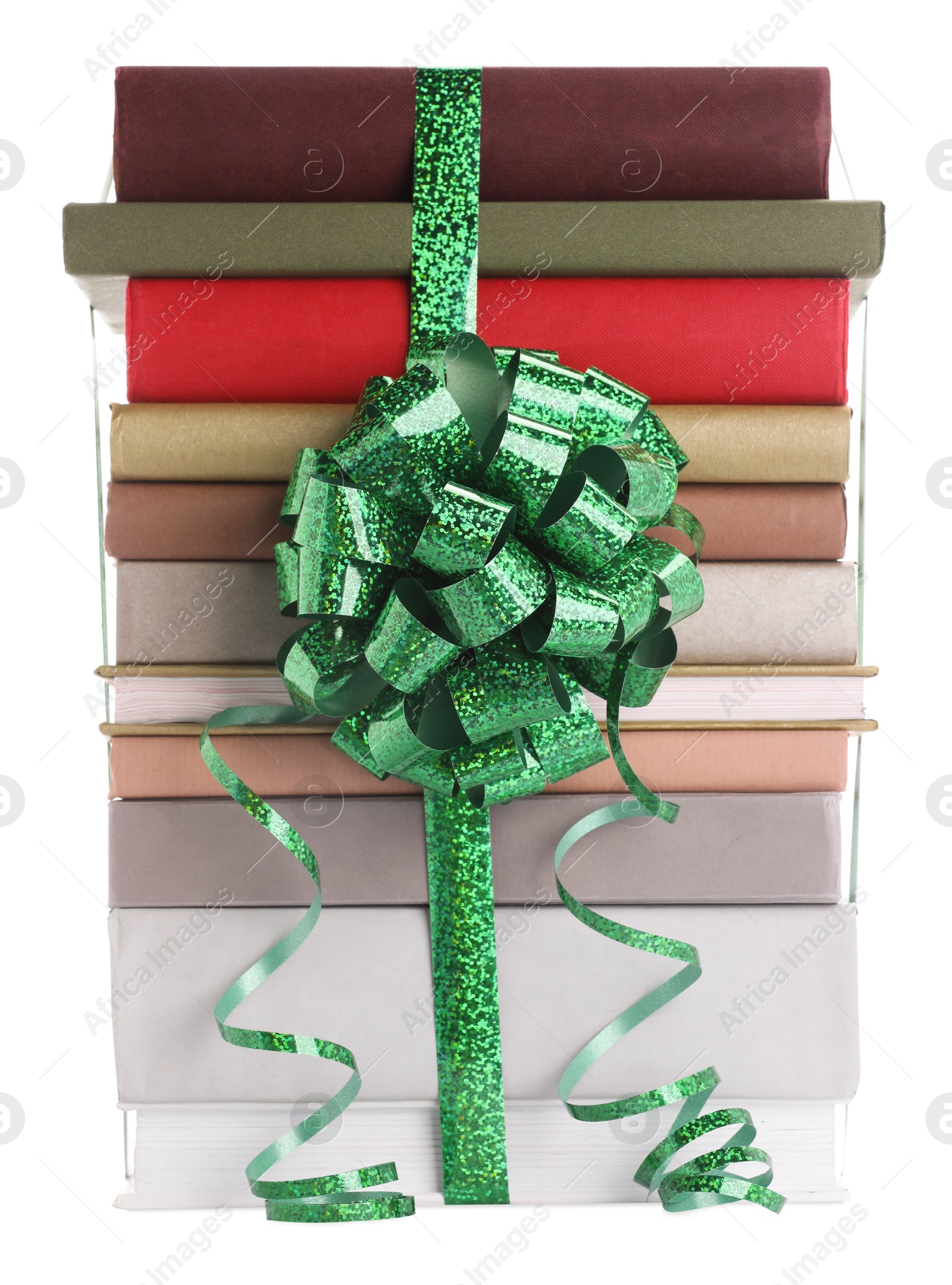 Photo of Stack of books with green bow as gift isolated on white