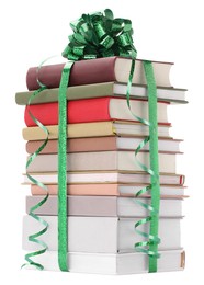 Photo of Stack of books with green bow as gift isolated on white