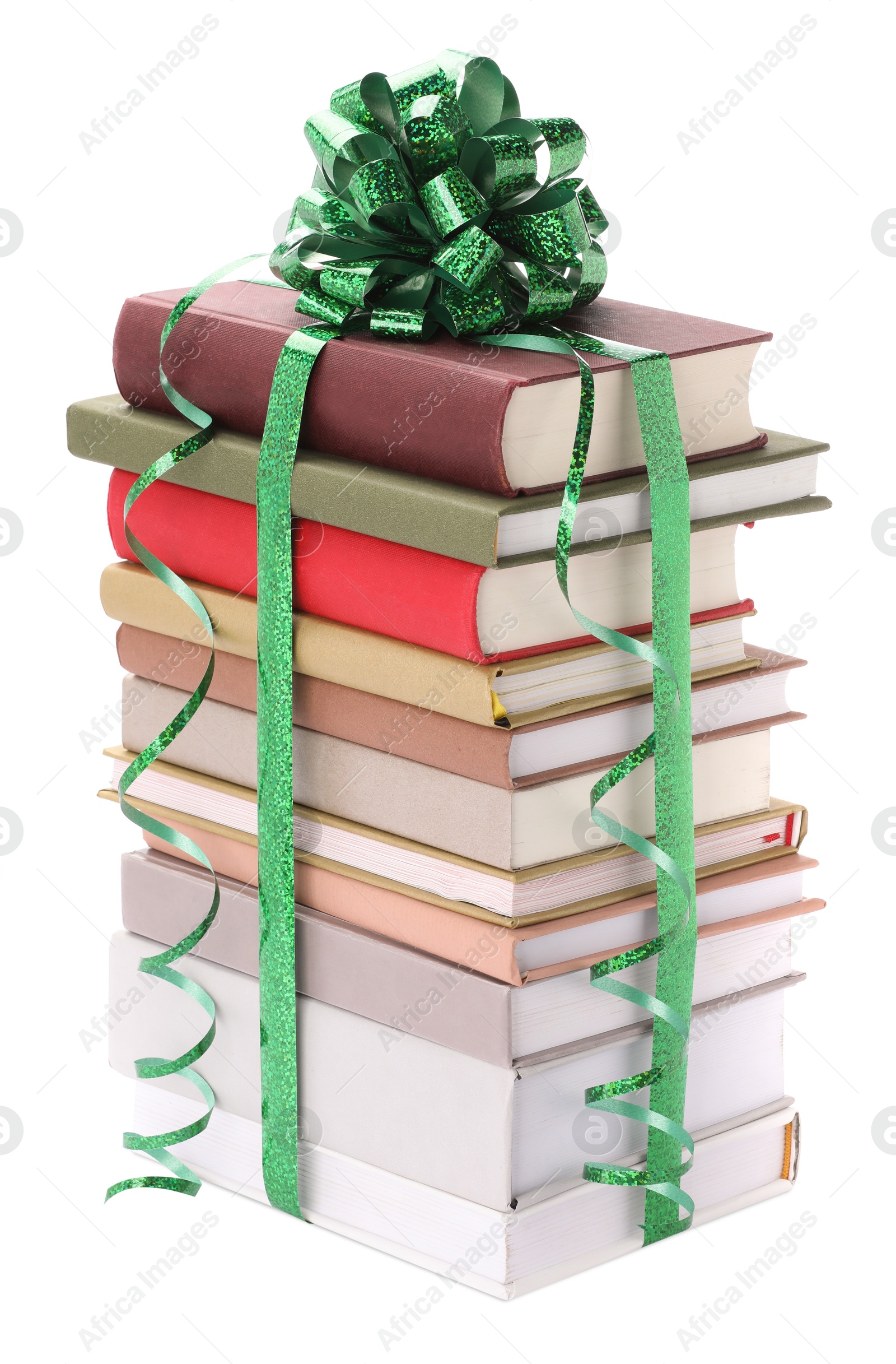 Photo of Stack of books with green bow as gift isolated on white