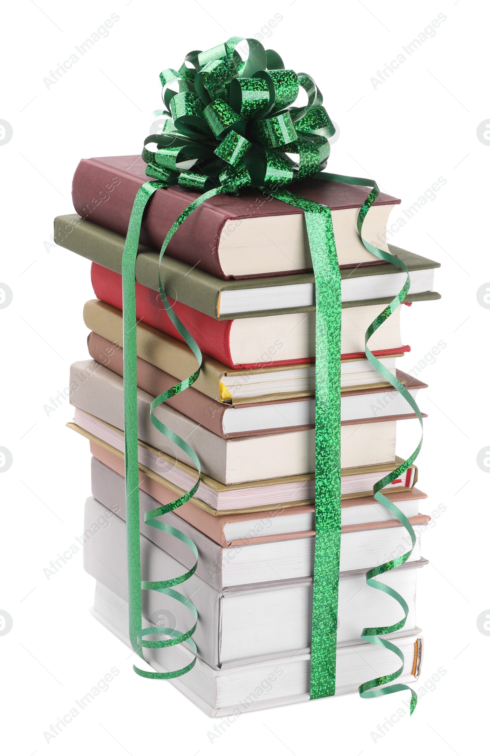 Photo of Stack of books with green bow as gift isolated on white