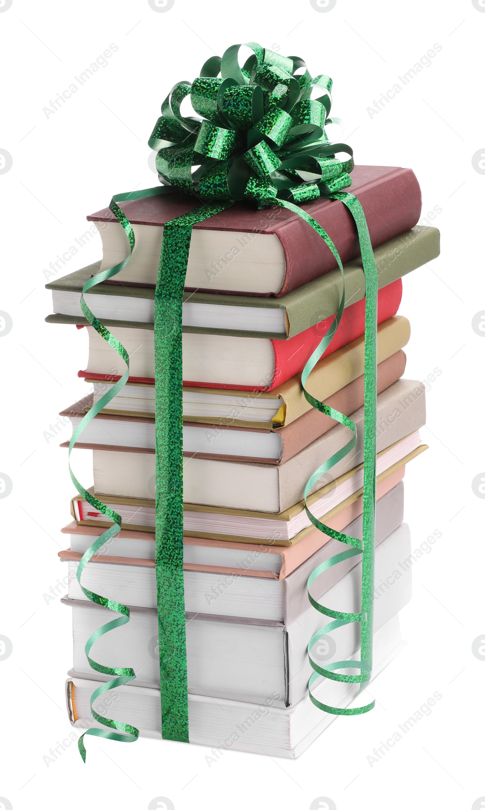 Photo of Stack of books with green bow as gift isolated on white