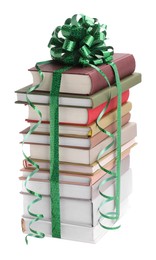 Photo of Stack of books with green bow as gift isolated on white