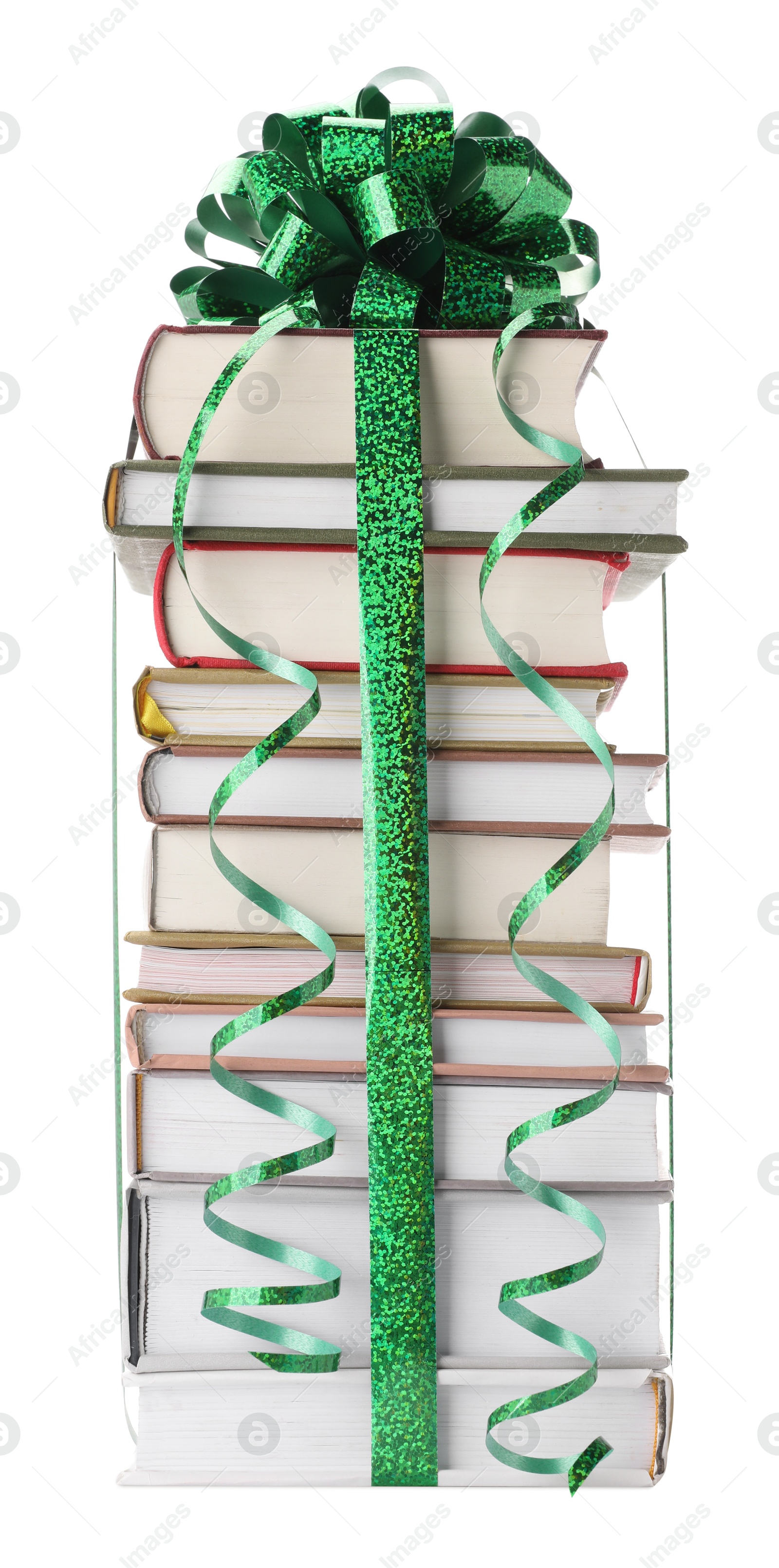 Photo of Stack of books with green bow as gift isolated on white