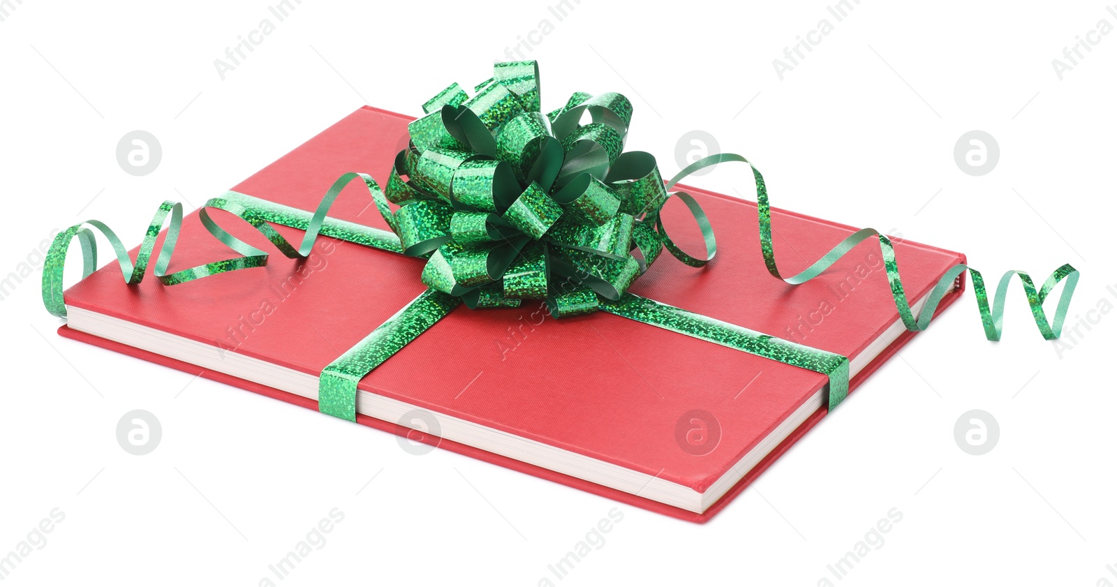 Photo of One book with green bow as gift isolated on white