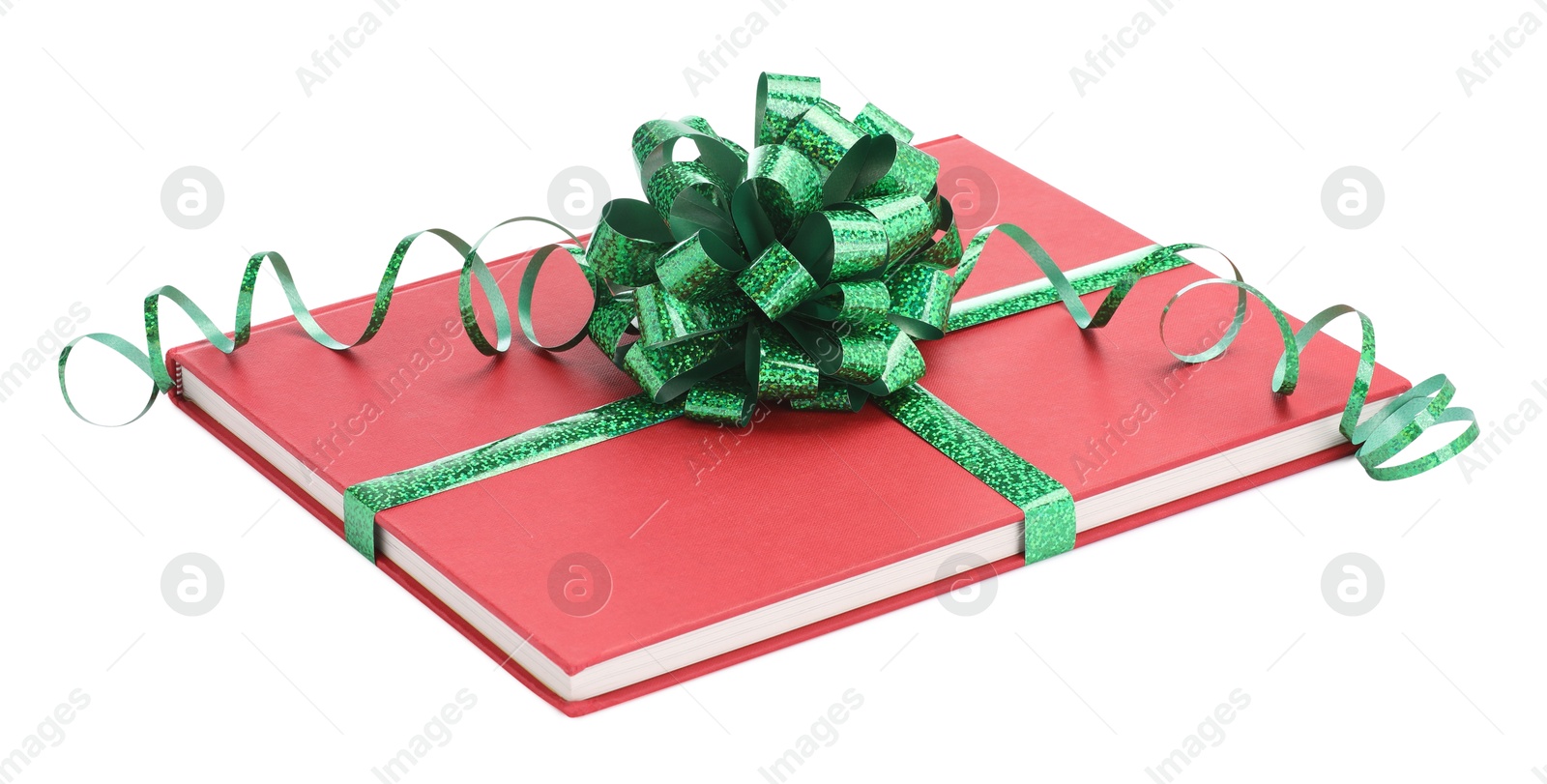 Photo of One book with green bow as gift isolated on white